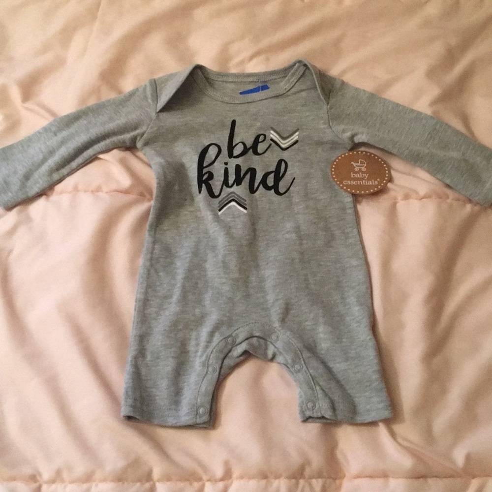 “HIGH EQ” baby onesie tags on